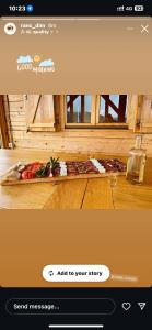a screenshot of a website with a picture of a tray of food at Ранч ДИМ in Ivanjica