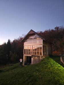 a man standing in front of a barn at Ранч ДИМ in Ivanjica