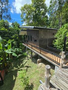 a house with a deck and a building at Khao Raa Terrace @Phangan in Ban Madua Wan