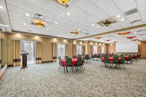 a conference room with red chairs and a podium at Comfort Suites Near Gettysburg Battlefield Visitor Center in Gettysburg +35 photos