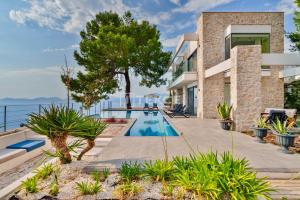 an image of a villa with a swimming pool at TEKCE Villa Faralya N131 in Kızılcakaya