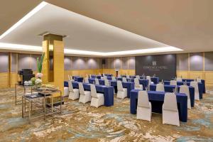 a conference room with rows of chairs and a stage at Concorde Hotel Kuala Lumpur in Kuala Lumpur