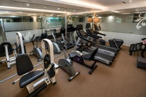 a gym with a bunch of cardio equipment in it at Golden Seoul Hotel in Seoul
