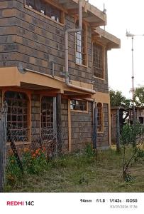 an old house with a fence in front of it at WANDA's in Makandara