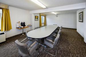 a conference room with a table and chairs at Crestwood Hotel in Hinton +46 photos