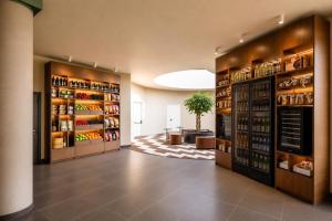 a large room with shelves of wine bottles at Hotel Fiera Rimini in Rimini
