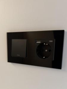 a picture of a wall mounted electrical outlet at Albergue -Hostel ManuelaINN in El Burgo de Osma
