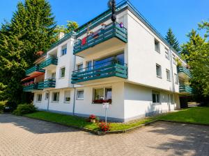 a large white building with balconies on a street at Moscow Areal Suite in Baden-Baden