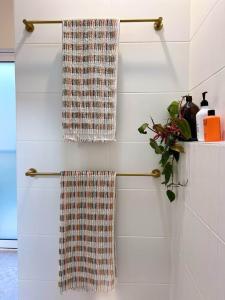 two towels hanging on a rack in a bathroom at Studio Jean - Dog-Friendly in Bremer Bay