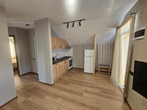 a kitchen with a sink and a counter top at George House in Batumi