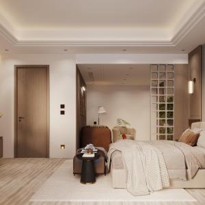 a bedroom with a large bed and a table at Ananta Elite in Somnath