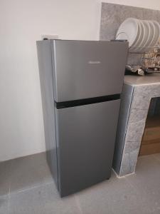 a refrigerator sitting on top of a counter at Blue Dhow Villas in Paje
