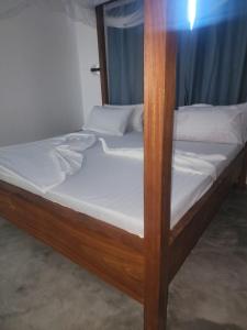 a couple of bunk beds in a room at Blue Dhow Villas in Paje
