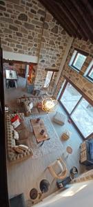 an overhead view of a living room with a stone wall at Molivos Castleview Luxury Villa with private parking in Mythimna +45 photos