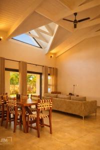 a living room with a table and a couch at Judith & Sylvester Hideaway in Victoria Falls