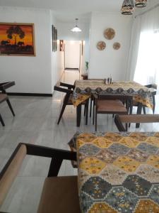 a dining room with a table and some chairs at Natisa Lodge in Livingstone