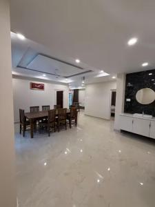 a dining room with a table and chairs at 3BHK Villa 15 min Thommankuthu Falls Groups in Thodupuzha