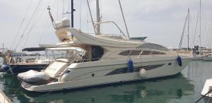 a white boat is docked in the water at Houseboat Dolce Vita in Novigrad Istria