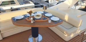a table on the side of a boat at Houseboat Dolce Vita in Novigrad Istria