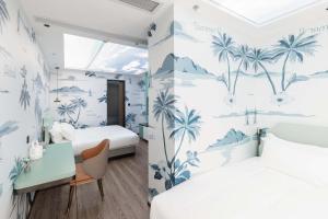 a hotel room with two beds and a desk and a desk at Secluded Comfort City Resort Hotel in Hangzhou +132 photos