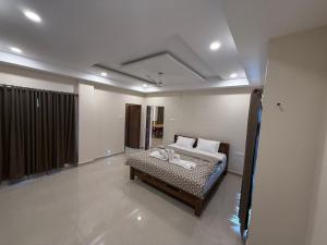 a bedroom with a bed in a room at 3BHK Villa 15 min Thommankuthu Falls Groups in Thodupuzha +17 photos