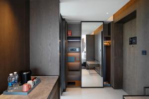a room with a hallway with a hallway at Four Points by Sheraton Hefei, Qirui in Hefei +53 photos
