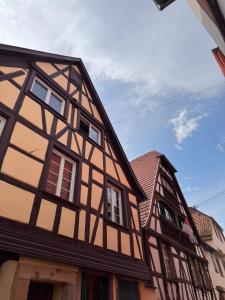 two old buildings are next to each other at Écrin de barr in Barr