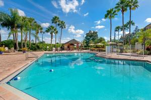 a pool at a resort with palm trees at Bluegreen Vacations Orlando's Sunshine, Ascend Collection Resort in Orlando