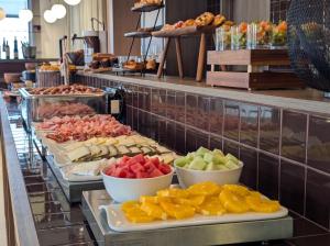 a buffet with many different types of food on display at Hotel Medium Montecarlo in Llafranc