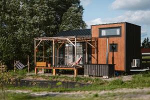 a tiny house is being built in a field at Jemiołucha Glamping in Bodzentyn