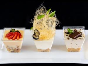 three desserts in plastic cups on a table at Goedgedacht Farm in Malmesbury