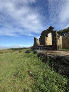 an old building sitting on top of a field at Seldom Seen in Malelane