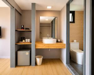 a bathroom with a sink and a toilet at HIP Seaview Resort @ Phi Phi in Phi Phi Islands +125 photos
