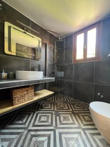 a bathroom with a sink and a tub and a toilet at Flower in Skiathos +37 photos
