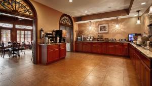 a large kitchen with a large counter top at Best Western Plus French Quarter Courtyard Hotel in New Orleans