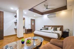 a hotel room with a bed and a table at Hotel Anand - Near Ganga Ram & BLK Hospital At Karol Bagh Metro Station in New Delhi +113 photos