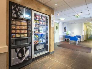 a vending machine in a store with food and drinks at Hotel Ibis Budget Vichy in Bellerive-sur-Allier