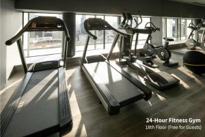 a gym with two treadmills and a treadmill at Hotel Intergate Osaka Umeda in Osaka +63 photos