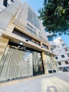 a store in front of a tall building at Le M Neo in Rabat