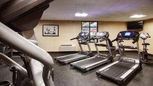 a gym with several tread machines in a room at Best Western Plus New Ulm in New Ulm