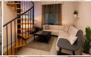 a living room with a couch and a table at Citadelle Liège Centre in Liège