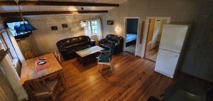 a living room with a couch and a table at Sona Camping in Hegra