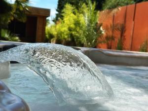 a water fountain in a swimming pool at Waterl'O in Waterloo +18 photos