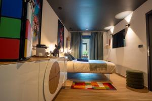 a bedroom with a bed and a rug on the floor at Waterl'O in Waterloo