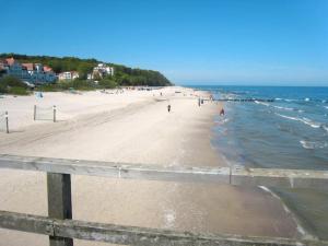 a view of a beach with people in the water at Bansin, Aquamarina WG 10 in Bansin