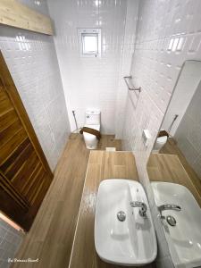 a white bathroom with a sink and a toilet at Pai Princess Resort in Pai +73 photos