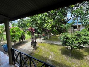a view of a garden from a balcony at Rapti Resort in Jhawāni