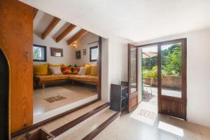 a living room with a couch and a table at Can Carabá in Illes Balears