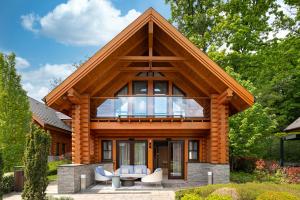 a house with a large window on top of it at Avalon Resort & SPA in Miskolctapolca