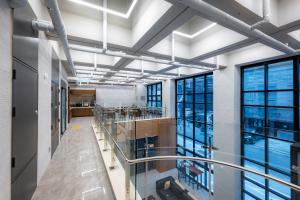 a large room with windows in a building at Jamsil Hotel Vene in Seoul